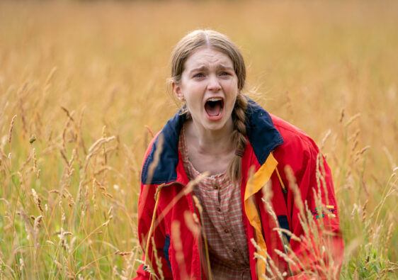 Screaming girl in field