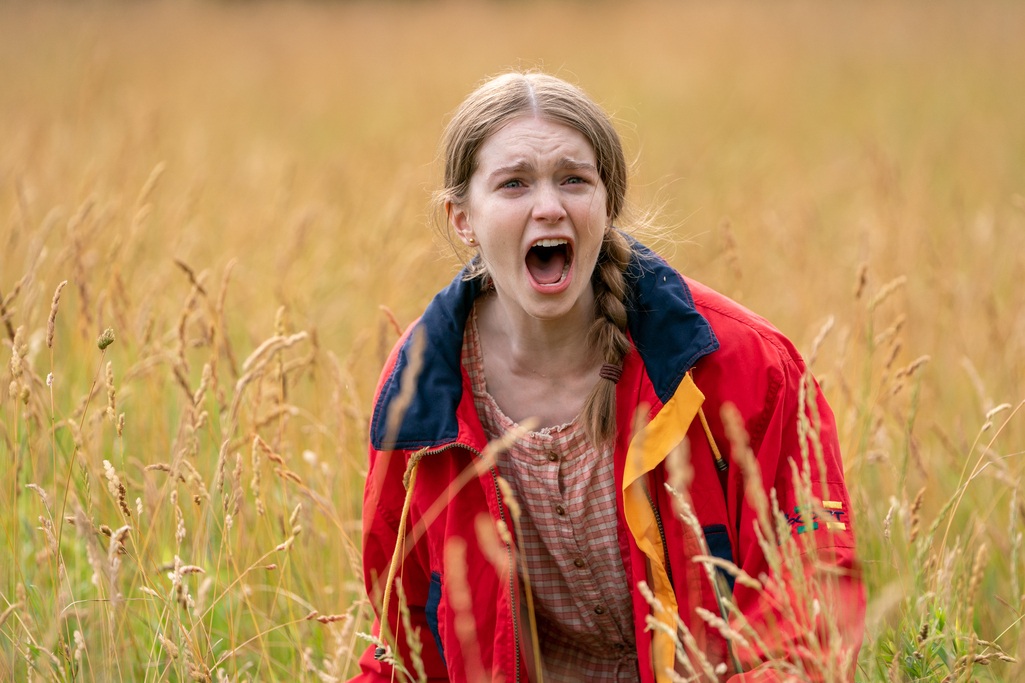 Screaming girl in field