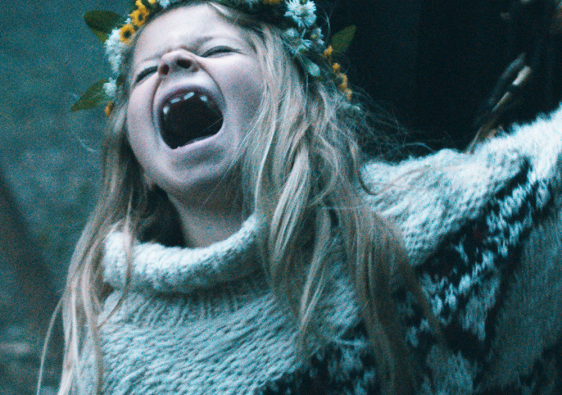 A still of the film Pelican Blood showing the screaming protagonist Raya. The title says "Pelican Blood. Now available on DVD, Blu-Ray and VOD."
